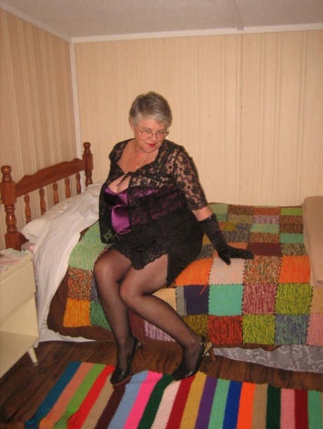 Black gloves and nakedness: The old, fatty Girdle Goddess gets up in her bedroom.