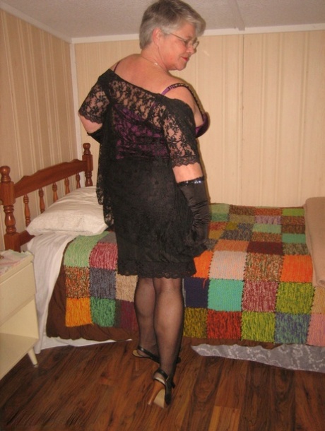 The old fatty Girdle Goddess exposes herself in her bedroom while wearing black gloves.