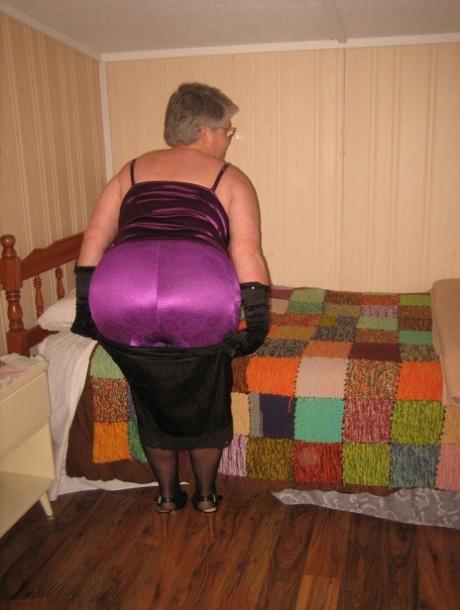In her bedroom, the old fatty Girdle Goddess exposes herself while wearing black gloves.