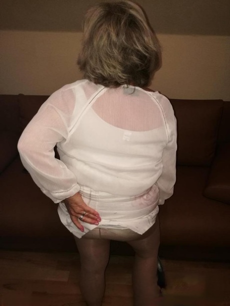 Mature Lady Exposes Her Large Tits While Having A Smoke In Pantyhose
