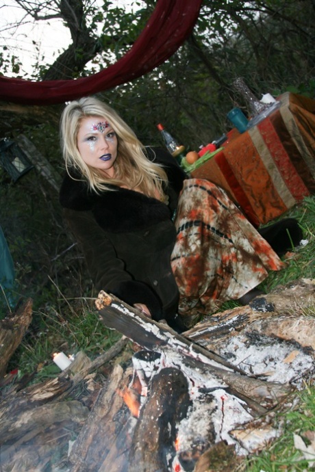 Amateur blonde Meet Madden models themselves wearing a bikini and OTK boots near the woods.