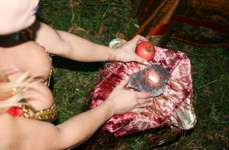 Meet Madden, a blonde amateur, models herself in bikinis and OTK boots while enjoying the woods.