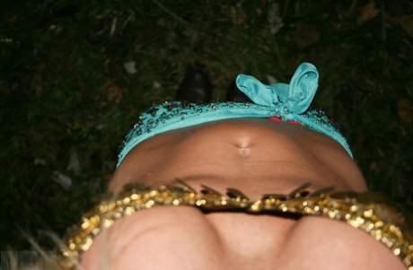 In a wooded area, Meet Madden showcases blonde amateurs wearing bikinis and OTK boots.