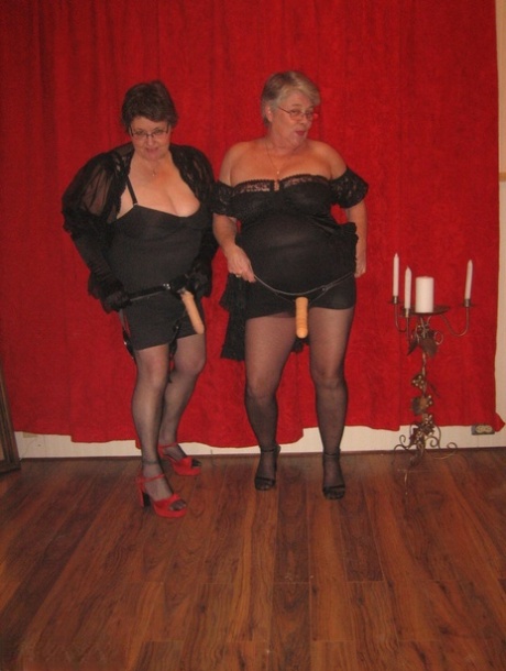 Big titted granny, the goddess of big-tisted gender, and her lesbian lover wear strapon cocks.