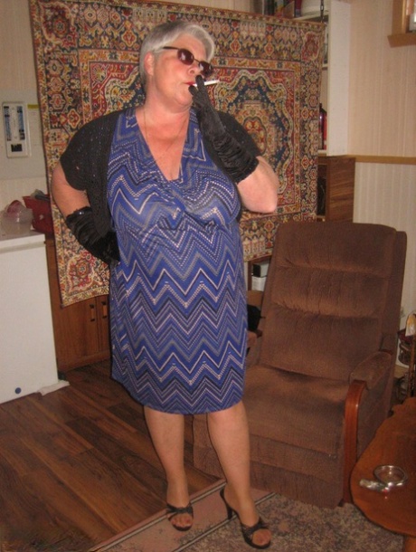 A naked fat granny girdle goddess wears clothing such as shades, gloves, and pantyhose.