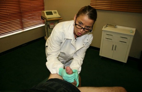 While wearing latex gloves, the female lab technician fucks and picks up something in her penis.