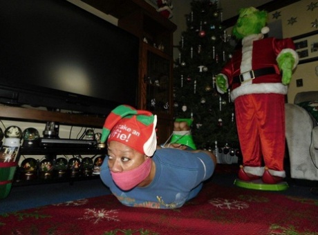 Ebony Female Finds Herself Gagged And Hogtied In Front Of A Christmas Tree
