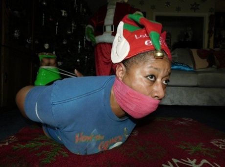 Ebony Female Finds Herself Gagged And Hogtied In Front Of A Christmas Tree
