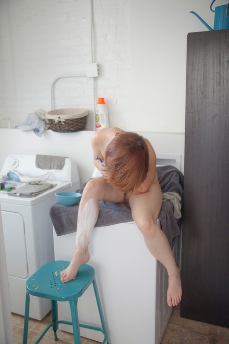 Big-tipped redhead: Chelsea Bell shows off her shaved legs as she waves in a slim ponytail.