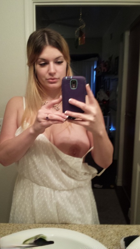 With a big boom, Danielle, an amateur photographer, takes nude selfies while around the house.