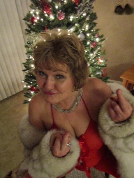 The Christmas season sees Busty Blis, an elderly lad, performing a blowjob while unveiling his matching lingerie.