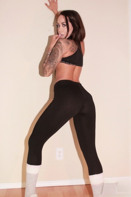 In a seductive manner, Cindy Cupcakes, the pretty brunette, strips herself on to white socks.