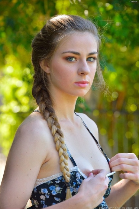 As part of a public demonstration, the amateur model toys with her banana stick and plays with it.