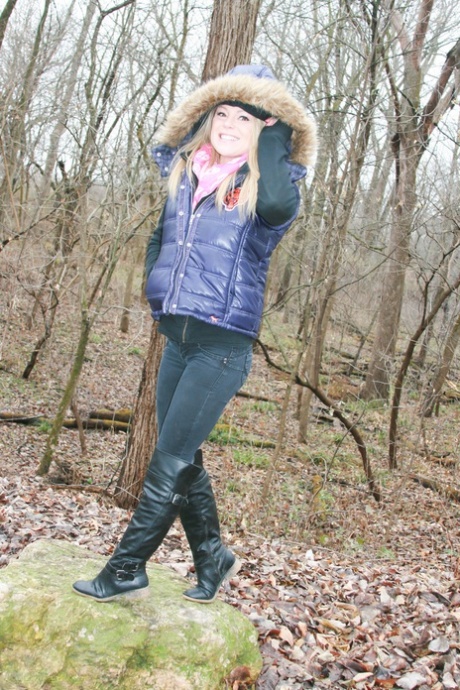 A warm day in the woods prompts amateur girl Meet Madden to expose a pink bra.