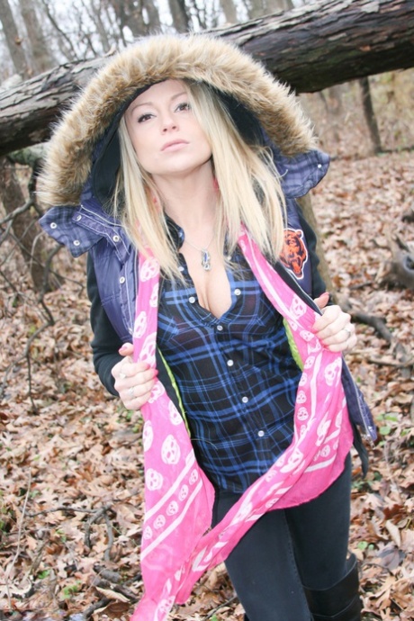 During a cold day in the woods, amateur girl Meet Madden flaunts her pink bra.