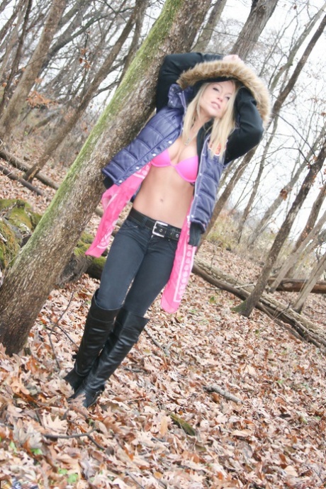 While hiking in the woods on a cold day, amateur girl Meet Madden flaunts her pink bra.