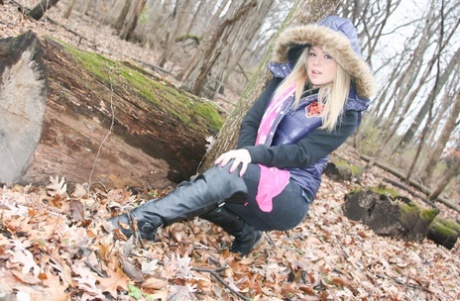 A warm day in the woods inspires amateur girl Meet Madden to show off her pink bra, which she wears while hiking outdoors.