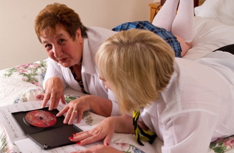 The older lesbian, along with Speedy Bee, a mature British fat man who removes their student uniform before sexual activity.