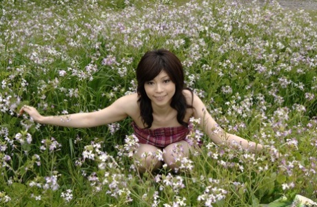 Japanese model Kurumi Katase wears upskirt panties while posing in the open air.