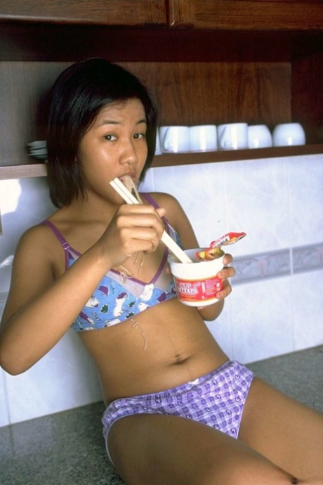 Cute Asian Girl Shows The Pink Of Her Pussy After Eating Noodles