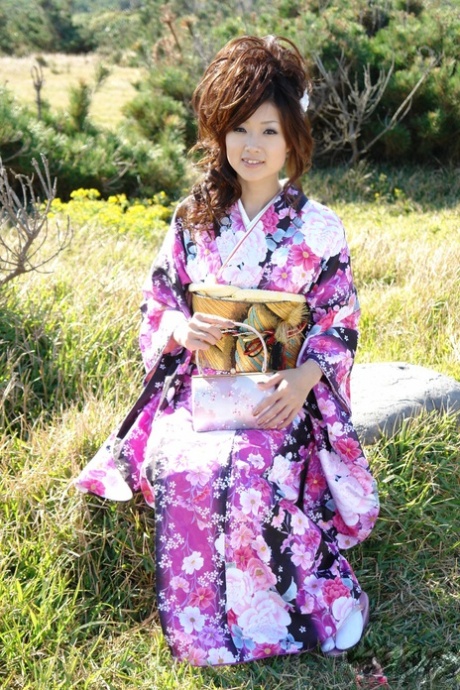 A kimono-clad Asian model named Chiaki strolls along the beach and surrounding area.