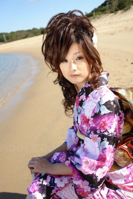 In a kimono, Chiaki, an Asian model, strolls along the beach and surrounding area.