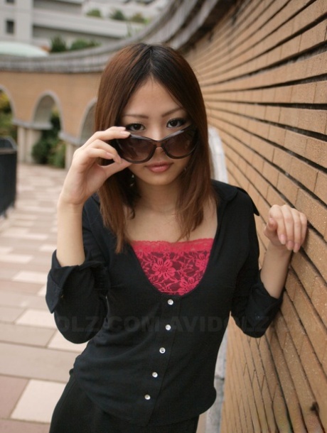 Fully Clothed Japanese Girl Lifts Up Sunglasses To Show Her Pretty Face