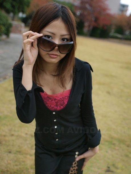 Fully Clothed Japanese Girl Lifts Up Sunglasses To Show Her Pretty Face