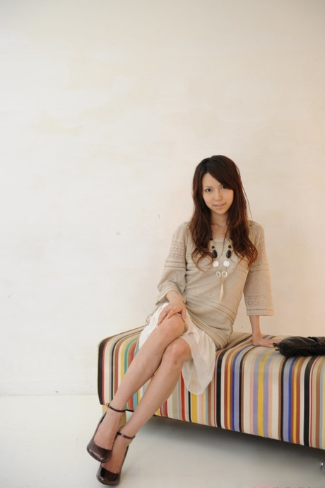 Rino Tokiwa, a Japanese solo girl who wears ankle strap shoes and no skirt, poses in unclothed clothing.