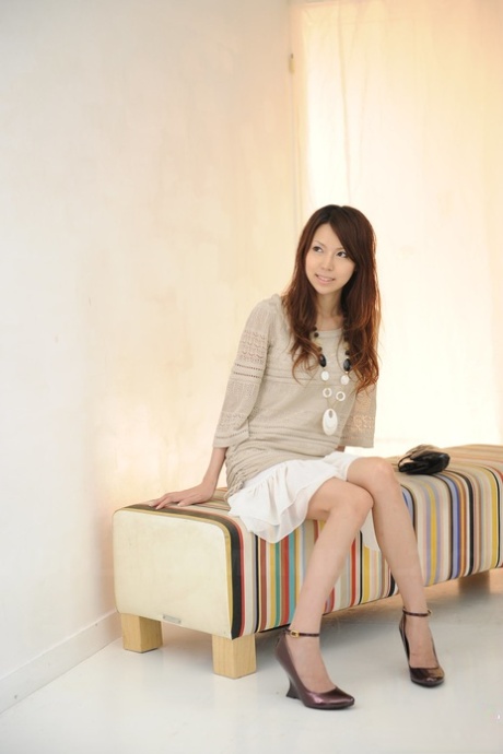 Non-nude photographs of Rino Tokiwa, a Japanese single girl, are shown, who wears an ankle strap and a skirt.