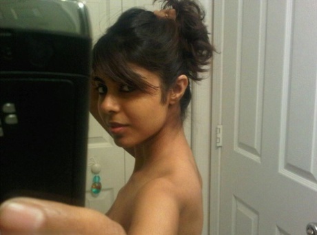 Pretty Indian Girl Uncovers Her Nice Tits While Taking Self Shots In A Mirror