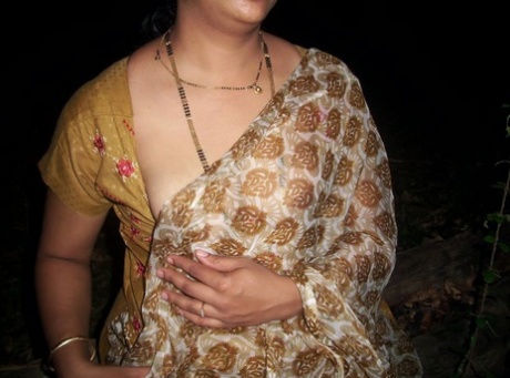The Indian maiden exposes her small tits before displaying her bare buttocks.