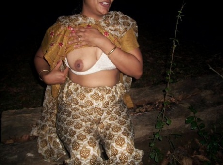 Her small tits are exposed before the Indian amateur displays her bare buttocks.
