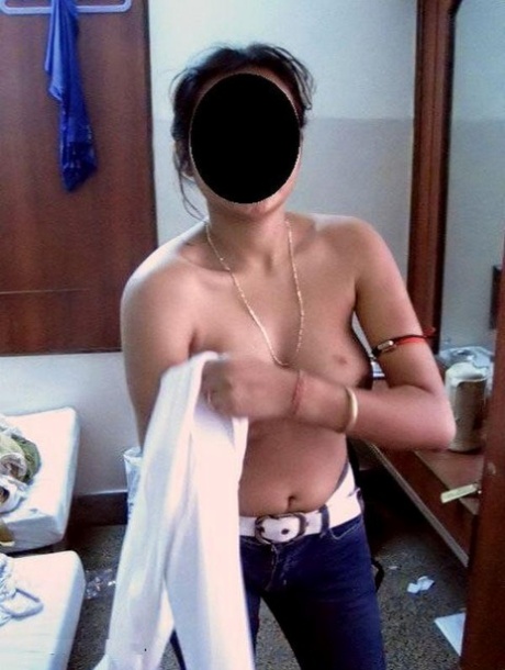The Indian amateur has a blackened face when she displays her natural tits.