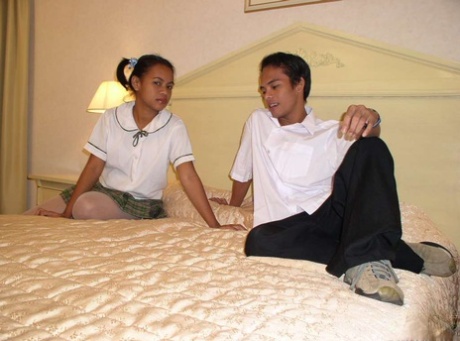 Asian Schoolgirl Gets Cum On Her Innocent Looking Face On Her Parent's Bed