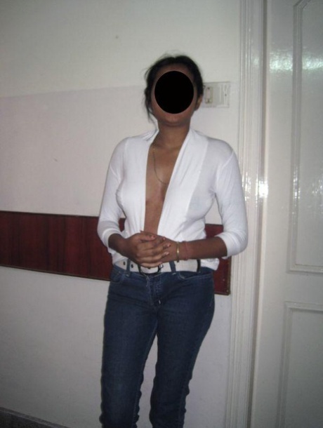 MILF, an indigenous Indian woman, exposes her natural tits while wearing blue jeans.
