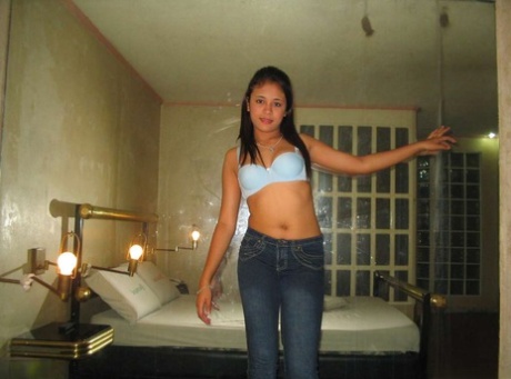 In a first-time solo action, a young Filipina girl goes completely naked for the very first time.