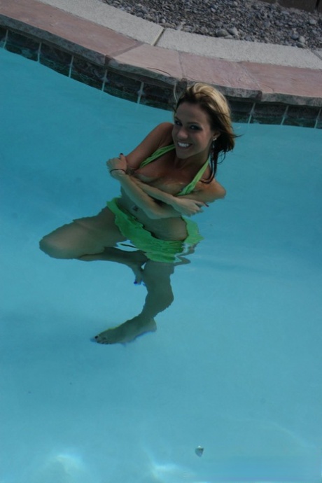 Using her swimsuits, amateur Addison St James frees herself from their bikinis in pool.