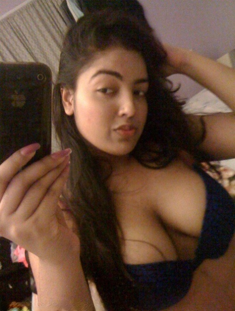Busty Indian Girl With Long Hair Changes Her Bras During Self Shots