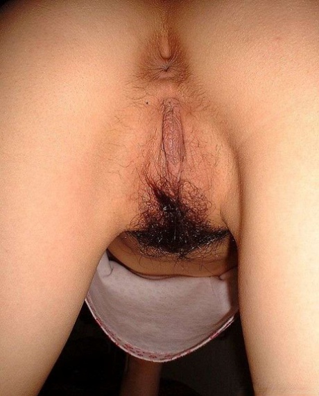 Japanese girl changes her lingerie while showing her trimmed bush