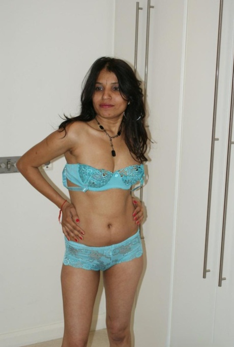 Teasing: Indian MILF Kavya Sharma strips off in the buff.