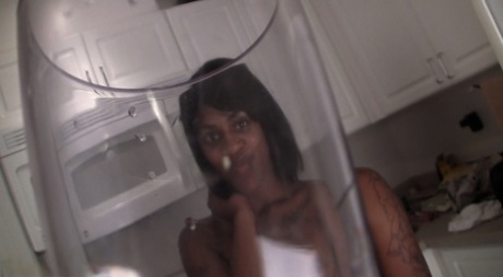 Naked Black Girl Pees In A Cup Before Swallowing It In The Kitchen