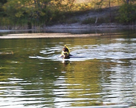 Best friends are in a threesome on the shore with a male kayaker.