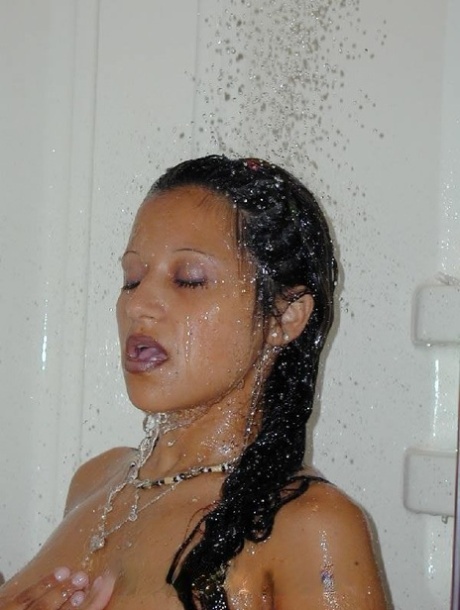 While in the shower and on a toilet seat, a busy Latina woman and her male friend have sex.
