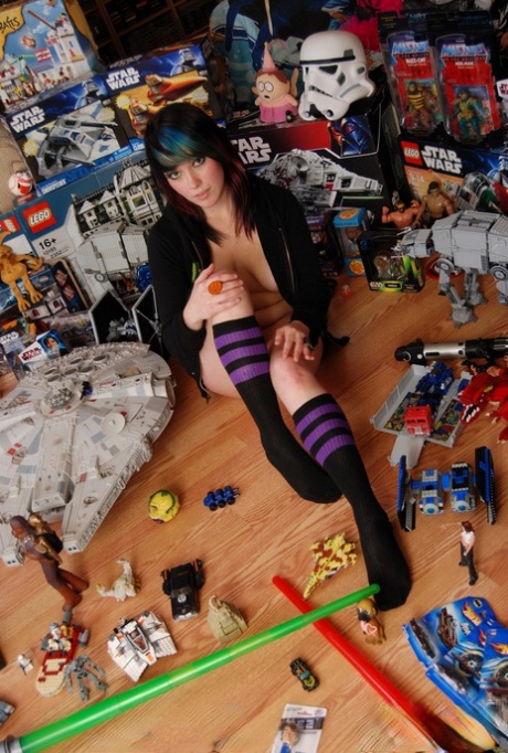 Sabrina, a dark-haired amateur, masturbates in front of her collection of toys.