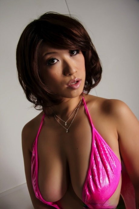 Japanese Woman Model Lets A Breast Slip Free While Modeling Swimwear