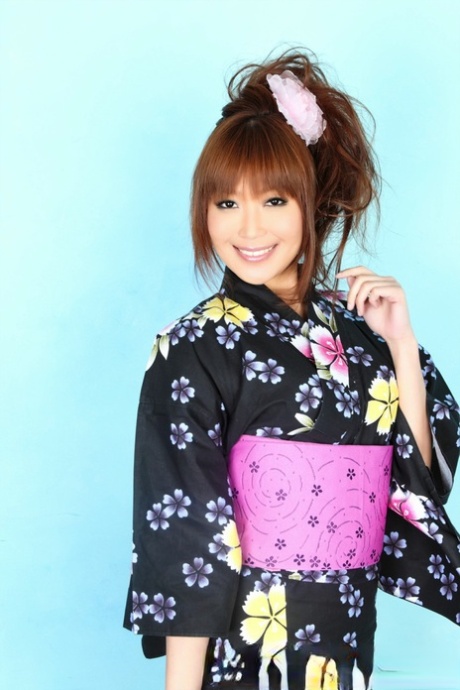 The sensual Japanese model lifts her kimono to reveal her satin panties.