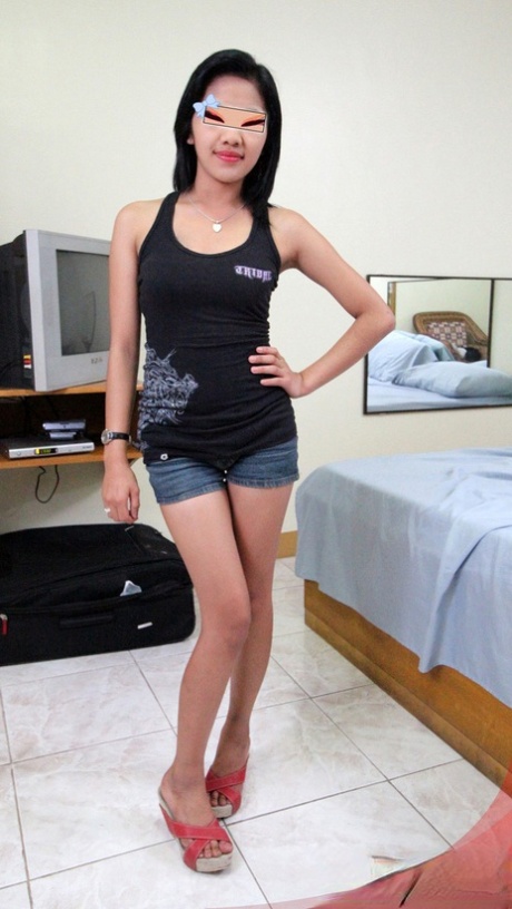 Before engaging in POV sex with a white man, Jenny undresses as a slim Filipina girl.