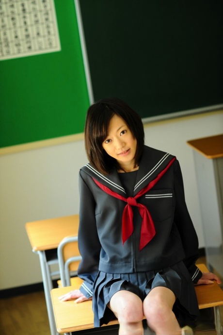 No-knit Japanese student, who is barely legal, displays her bare knees in school uniform.