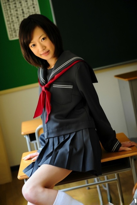The solely legal student in Japan exposes her knees while wearing her school uniform.